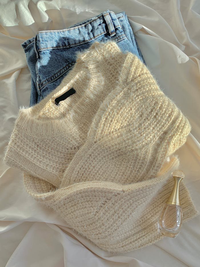 Warm wool sweater paired with classic blue jeans for a cozy winter look.